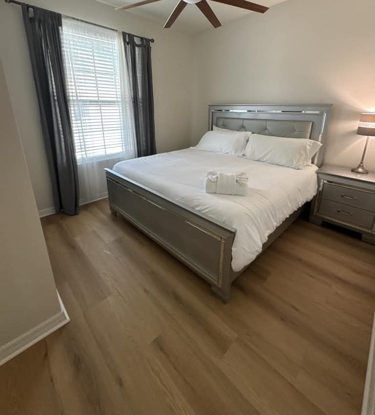 Primary bedroom with crisp white linens
